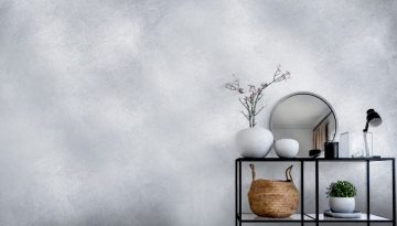 Single modern black display in front of white wall