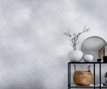 Single modern black display in front of white wall